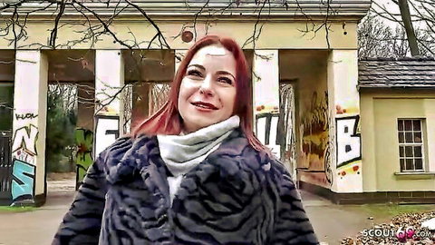 Curvy redhead Emma Fox smiling in fur coat at German scout casting