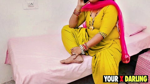 Desi stepmom in yellow salwar kameez sits with cameltoe tease on phone