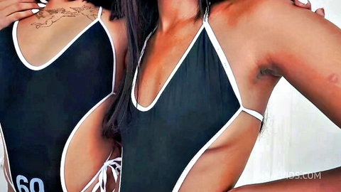 Two busty ebony trans babes in skimpy black bikinis embracing with tattoos and armpit hair