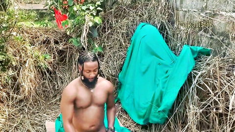 Muscular ebony Nigerian man with dreads sits naked outdoors exposing his cock in amateur video