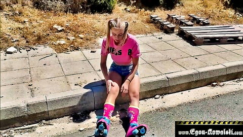 Blonde pigtail teen roller skater in pink shorts spreads legs teasing outdoors