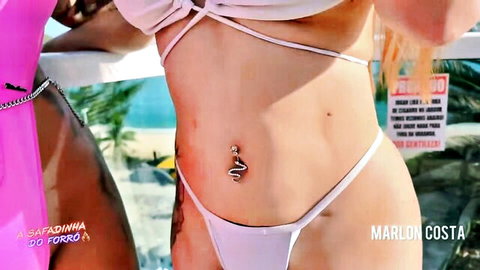 Maite Sasdelli in skimpy white bikini with belly chain by pool