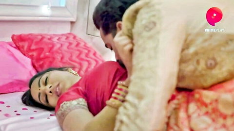 Indian MILF in red saree lies on bed groped and kissed passionately by lover