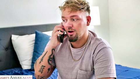 Tattooed blonde guy on phone in bed, from Olivia Madison's sister's hot friend video