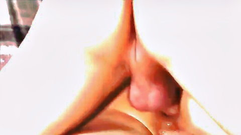 Close-up of young woman's shaved pink pussy lips spread open