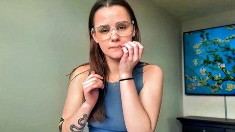 Brunette teen step sister in blue tank top touches lips seductively