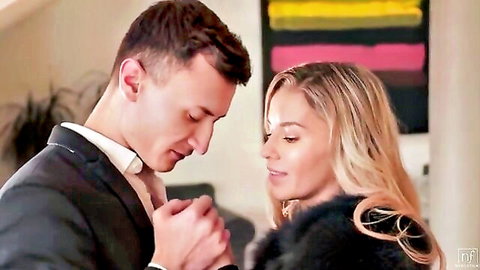 Lika Star gazes intimately with suited partner in fur coat, softcore tease