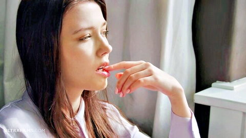 Mila Azul teases with fingers on lips in purple top, seductive gaze