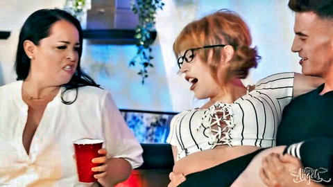 Trans redhead with glasses in lace-up top, curvy brunette, and man laughing together