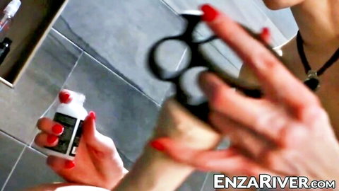 River Enza tgirl dominatrix with brass knuckles and red nails