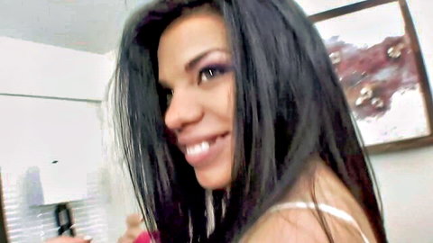 Tina Baby petite Latina smiling in white top