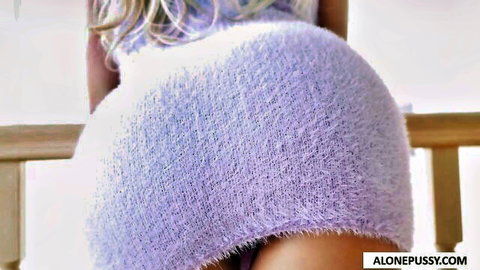 Brandi Love bent over in tight purple fuzzy sweater, teasing ass view