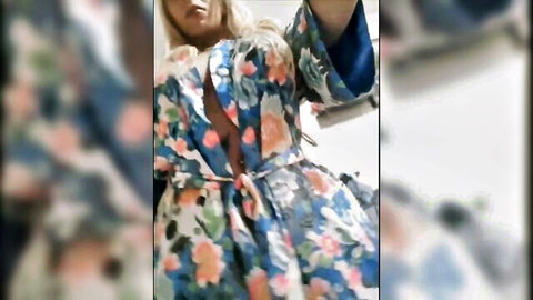 Blonde South American shemale teasing in open floral robe, big tits exposed