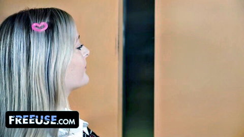 Blonde woman with pink heart clip in elevator, FreeUse tease