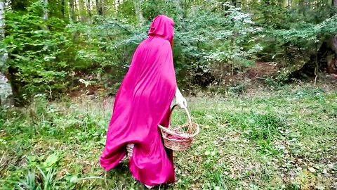 Curvy brunette in Little Red Riding Hood cosplay walks through forest showing big ass and thighs