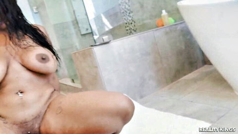 Wet curvy Latina stepmom naked in shower, big tits and spread pussy visible