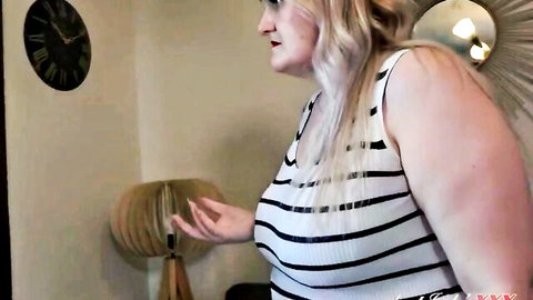 Blonde BBW babe with massive tits in tight striped tank top gesturing seductively