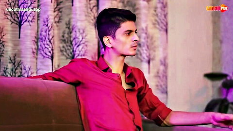 Handsome Indian man in open red shirt, leaning back seductively
