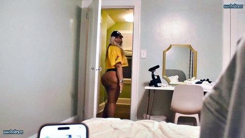 Thick ebony babe teasing her huge juicy ass cheeks in tight yellow shorts from behind in amateur POV