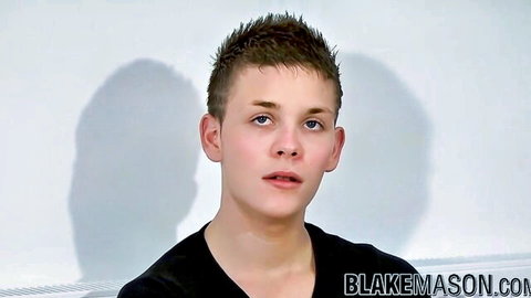 Cute young UK amateur with short hair in black shirt, solo interview tease
