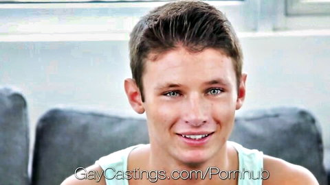 Amateur young guy smiling in tank top at gay porn casting prep