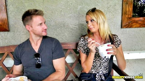 Blonde MILF Whitney and Levi Cash flirt outdoors in leopard top
