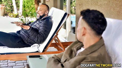 Bearded man in jacket lounges poolside with fit guy, teasing trans sex encounter