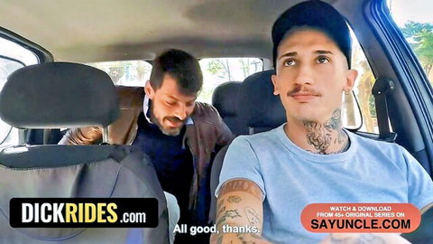 Tattooed twink in blue shirt smiles in taxi backseat as mustached driver glances back, Dickrides preview