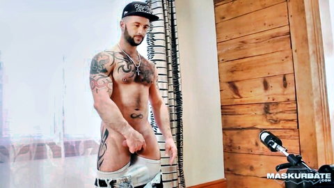 Tattooed muscular man exposes penis in milking machine tryout at Love Trans Sex