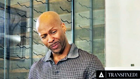 Bald black man in polo shirt from Transfixed interracial trans scene