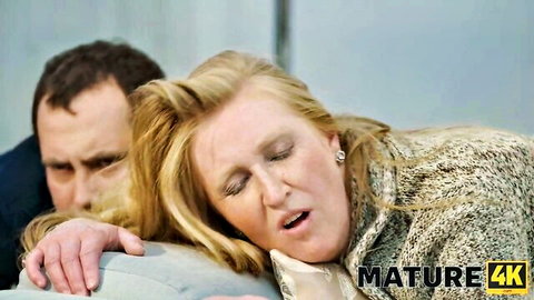 Blonde mature woman with O-face moaning as man grips her neck passionately