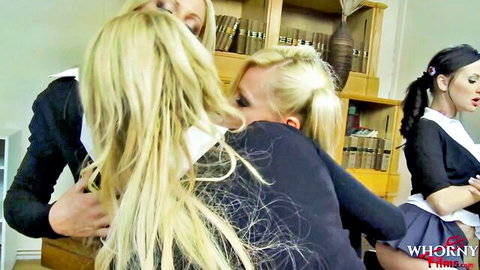 Three busty schoolgirls in uniforms passionately hugging and neck kissing in library