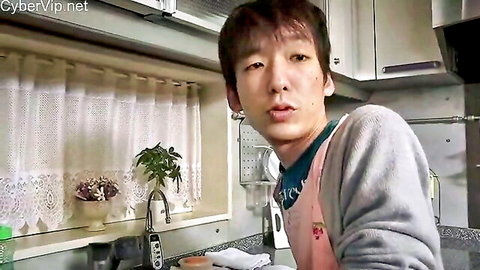 Handsome Asian guy in pink apron smiling teasingly in kitchen ready for hot fuck