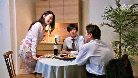 Smiling Japanese maid in blouse and apron serves pasta and wine to two suited East Asian men at dinner table