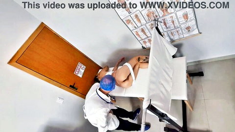Doctor in scrubs fucks bound nude patient on exam table