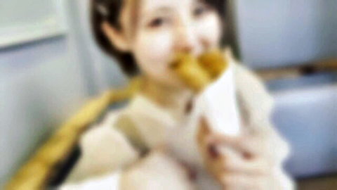 Smiling Japanese beauty in sweater enjoying snack, last JAV appearance