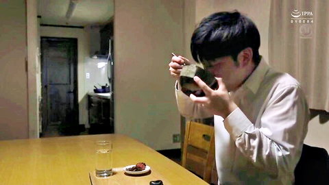 Japanese man in white shirt eating at table in JAV scene from 'I Was Fucked By My Husband's Boss'