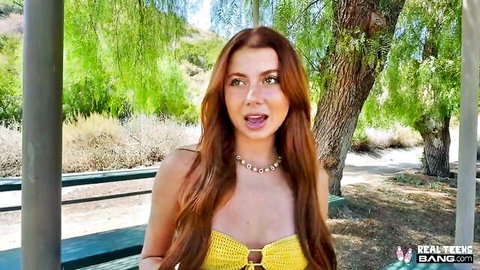 Redhead teen with small tits in skimpy yellow crochet bikini top outdoors mouth agape teasing blowjob