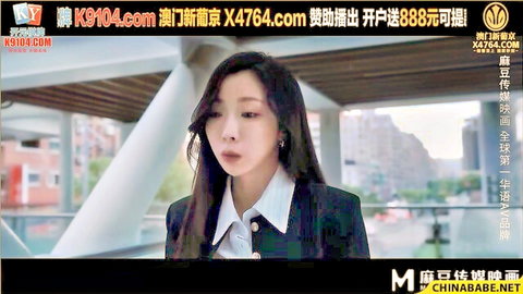 Elegant Asian businesswoman in black suit on urban balcony, seductive gaze