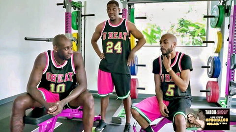Three muscular black BBC studs in tight neon Miami Heat jerseys posing in gym