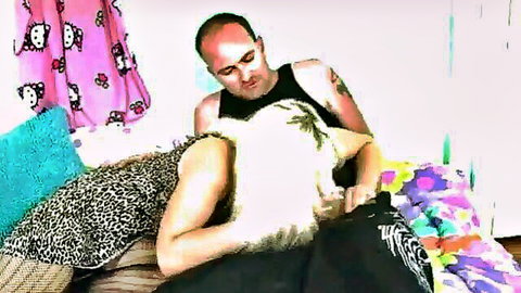 Tattooed bald guy fingers blonde's bare ass and pussy on colorful bed