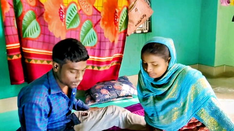 Desi beauty Deluwara in blue traditional attire with partner in home setup