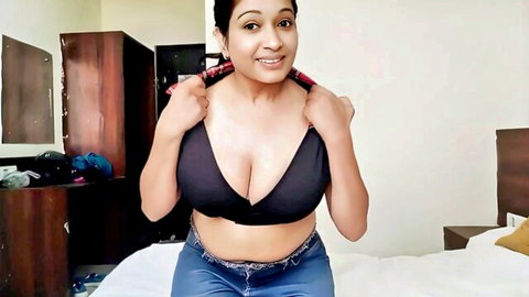Savita Bhabhi in deep V black bra, big cleavage tease on bed