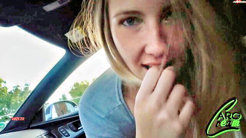 Blonde teen teases blowjob with pursed lips and fingers in car POV