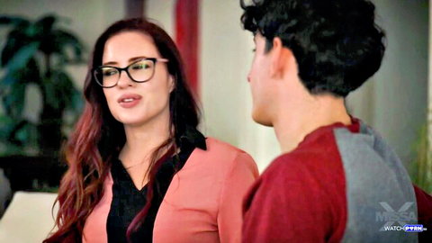 Redhead MILF with glasses intimately talks to young curly-haired stud in taboo scene