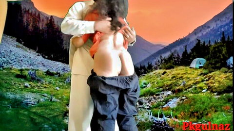 Clothed man pulls down woman's pants exposing her big bare ass outdoors in mountains at sunset grabbing her tits