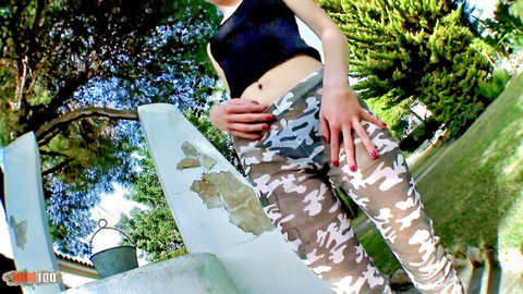 Slim French blonde Candys Chupa teases in camo pants POV outdoor