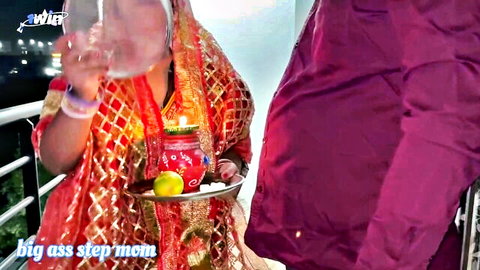 Jauli Chaupada in red saree performing Indian wedding ritual with tray