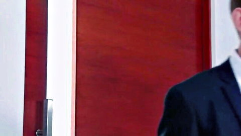 Russian driver in suit by red door, teasing Asian hookup