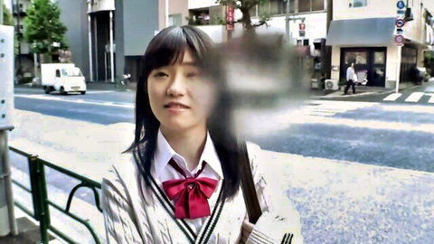 J Love as cute Asian schoolgirl in uniform, smiling outdoors in JAV bukkake preview